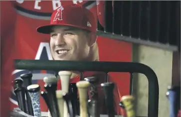  ?? Robert Gauthier Los Angeles Times ?? AN INJURED Mike Trout watches Albert Pujols’ pursuit of 600 homers from the dugout Wednesday night.