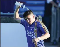  ??  ?? Andy Foley tries to cool down in the heatwave during the Leinster Minor Football Championsh­ip in Parnell Park.