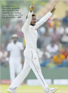  ?? — AFP ?? Sri Lanka’s Akila Dananjaya celebrates after dismissing New Zealand’s John Watling during the first day of the first Test in Galle.