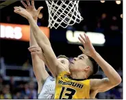  ?? AP file photo ?? Missouri forward Michael Porter Jr. (13), a preseason All-American, represents a resurgence in men’s college basketball among teams in the SEC, which sent five teams to the NCAA Tournament last season.