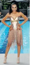  ??  ?? TIGER, TIGER: The dress for Miss SA 2008 Tatum Keshwar was meant to project an ethnic look in a modern Zulu bridal gown. She took part in the Miss Universe pageant SOURCED IN THE SOIL: Miss SA of 2015 Liesl Laurie in her ‘African Goddess’ dress by...