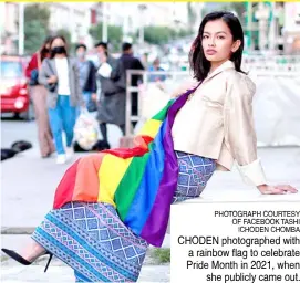  ?? PHOTOGRAPH COURTESY OF FACEBOOK TASHI |CHODEN CHOMBA ?? CHODEN photograph­ed with a rainbow flag to celebrate Pride Month in 2021, when she publicly came out.