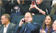  ?? Kathy Willens / Associated Press ?? Knicks president Leon Rose, center, takes a phone call during the first quarter of a game against the Rockets in New York on March 2. Two former Knicks did not mince words about Rose and William Wesley. Rasheed Wallace and Stephon Marbury both voiced their displeasur­e with the new management team.