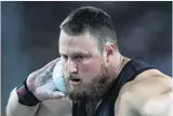  ??  ?? Tom Walsh, of Timaru, on his way to winning a gold medal in the shot put final. His winning throw was 21.41m.