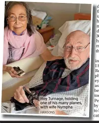  ?? HANSONS ?? Roy Turnage, holding one of his many planes, with wife Nympha