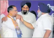  ?? HT PHOTO ?? Shiromani Akali Dal president Sukhbir Singh Badal offers sweets to former cabinet minister Anil Joshi after inducting him into the party fold in Chandigarh on Friday.