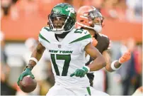  ?? DAVID RICHARD/AP ?? Jets wide receiver Garrett Wilson celebrates after getting past Browns safety Grant Delpit for the winning touchdown Sunday in Cleveland.