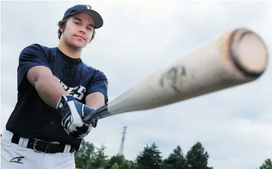  ?? TYLER BROWNBRIDG­E/The Windsor Star) ?? Nathan Picchioni takes a swing at a ball diamond in Windsor. The Windsor native has won several awards while playing baseball in Australia.