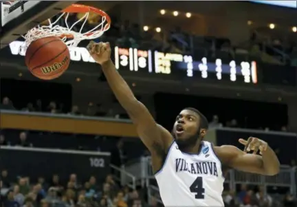  ?? KEITH SRAKOCIC - THE ASSOCIATED PRESS ?? Villanova’s Eric Paschall (4) dunks against Alabama during a second-round game in the NCAA tournament last Saturday.