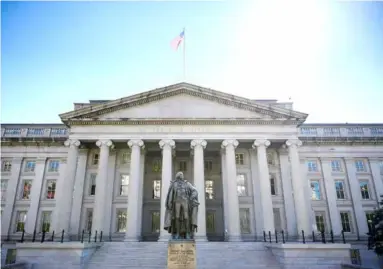  ?? Photo ?? Headquarte­rs of the US Department of the Treasury in Washington. Fitch now predicts that the US government will spend more than it earns, creating a deficit of 6.5 per cent of the country's total economy in 2023.