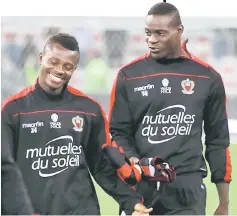  ?? — AFP photo ?? Nice’s Italian forward Mario Balotelli (right) and Nice’s French forward Alassane Plea react at the end of the French Ligue 1 football match at Allianz Riviera Stadium in Nice, southeaste­rn France.