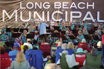  ?? SCOTT VARLEY — STAFF PHOTOGRAPH­ER ?? The Long Beach Municipal Band performs a free concert for a large crowd of families in Whaley Park in Long Beach on July 2, 2019. Summer concerts are getting ready to start in Long Beach.