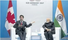  ?? RYAN REMIORZ/THE CANADIAN PRESS ?? Prime Minister Justin Trudeau, left, chats with Indian Prime Minister Narendra Modi during their bilateral meeting at the G20 summit Friday, in Hamburg, Germany.