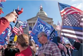  ?? AP PHOTO/ BEN GRAY ?? Supporters of President Donald Trump rally outside of the Georgia State Capitol in Atlanta on Saturday.