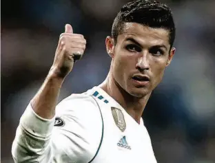  ?? Francisco Seco/AP ?? O português Cristiano Ronaldo anotou dois gols na estreia do Real Madrid, o atual campeão da Liga dos Campeões e que busca seu 13º título da competição