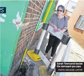  ?? PHOTO: GRAHAME LARTER ?? Sarah Townsend beside the damaged gas pipe