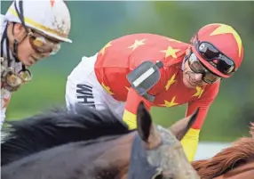  ??  ?? Mike Smith, aboard, Justify reacts after winning the the 150th Belmont Stakes on June 9. DOUGLAS DEFELICE/USA TODAY SPORTS