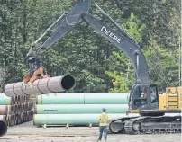  ?? JONATHAN HAYWARD THE CANADIAN PRESS FILE PHOTO ?? Canada’s oil industry is suffering from a lack of pipeline space that has weighed on prices and prevented output increases.