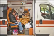  ?? AP photo ?? Patients are evacuated from Children’s Hospital No. 1 on the outskirts of Kyiv, Ukraine on Friday. They were evacuated after a video circulated online saying Russia planned to attack it.