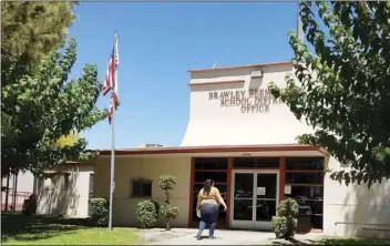  ?? PHOTO JULIO MORALES ?? Parents crowded the Brawley Elementary School District office on Monday to register their children for school after issues arose following the deployment of a new online registrati­on system this year.