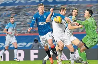  ??  ?? Rangers’ Cedric Itten takes on Ross County’s Callum Morris