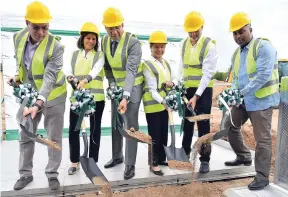  ??  ?? Daryl Vaz (left), minister without portfolio in the Ministry of Economic Growth and Job Creation; Jacqueline Stewart-Lechler (second left), director of Stewart’s Automotive Group; and Prime Minister Andrew Holness (third left) break ground for the new Jaguar and Land Rover showrooms with Diana Stewart (third right), Stewart’s Automotive chairman; Duncan Stewart (second right), Stewart’s Automotive director; and Julian Robinson, member of parliament for South East St Andrew, at 2 South Avenue in St Andrew on Thursday.