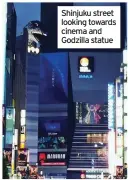  ??  ?? Shinjuku street looking towards cinema and Godzilla statue