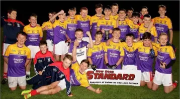  ??  ?? St. Mary’s (Maudlintow­n) celebrate their New Ross Standard Under-14 football championsh­ip win.