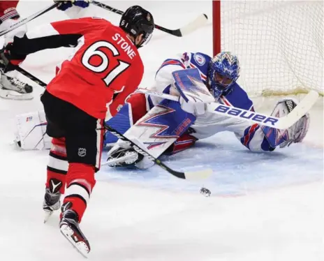  ?? SEAN KILPATRICK/THE CANADIAN PRESS ?? Rangers goalie Henrik Lundqvist robs Mark Stone of the Senators in Thursday night’s series opener in Ottawa. King Henrik finished with 41 saves.