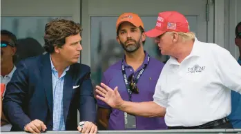  ?? SETH WENIG/AP 2022 ?? Former President Donald Trump, right, talks with Donald Trump Jr., center, and Fox News Channel host Tucker Carlson during the final round of the Bedminster Invitation­al LIV Golf tournament last summer in Bedminster, N.J.