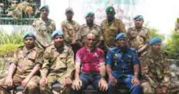  ??  ?? On the traning ground … Air Niugini instructor Martin Tugano (in maroon T- shirt) with PNG Defence Force personnel.