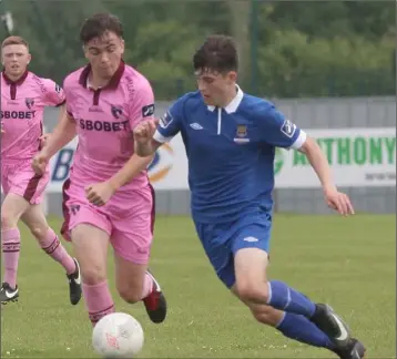  ??  ?? Patrick Barron of Wexford F.C. about to challenge Waterford’s Colm Whelan.