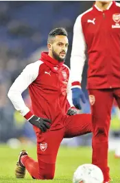  ??  ?? Arsenal’s English midfielder Theo Walcott warms up ahead of the English League Cup semi-final first leg football match between Chelsea and Arsenal at Stamford Bridge in London on January 10, 2018. - AFP photo