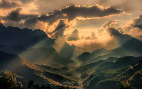  ??  ?? HEALED BY THE PASSAGE OF TIME: The sun’s rays shine on the once-troubled Vietnamese mountains. Photo: Gerry Andrews