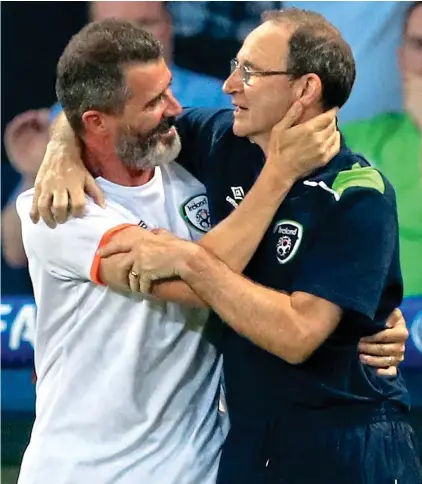  ?? PA ?? Just the two of us: Roy Keane (left) and Martin O’Neill embrace after beating Italy in Lille