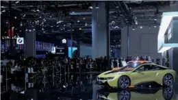  ?? XINHUA ?? The atmosphere at the 2017 Shanghai Auto Show was electric, as were many of the cars. Luxury automaker BMW said it is prepared to meet the demands of China’s new-energy vehicle market.