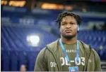  ?? DARRON CUMMINGS — THE ASSOCIATED PRESS ?? Georgia defensive lineman Jalen Carter watches as players warm up before the NFL scouting combine in Indianapol­is on Thursday.