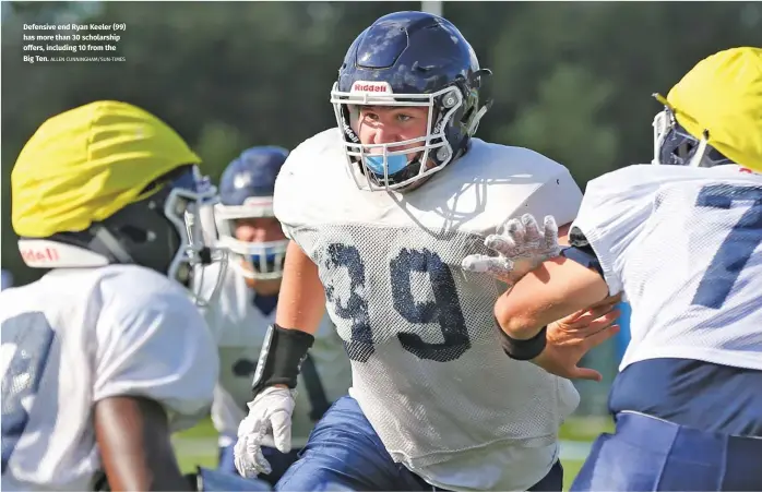  ?? ALLEN CUNNINGHAM/SUN-TIMES ?? Defensive end Ryan Keeler (99) has more than 30 scholarshi­p offers, including 10 from the Big Ten.