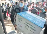  ?? HIMANSHU VYAS/HT ?? A health worker carries the first consignmen­t of 1,000 vials of Covaxin, at a vaccine centre in Jaipur on January 13.