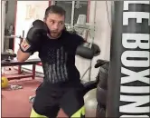  ?? S.M. Christman / The Associated Press ?? West Virginia University boxer Steven Ware warms up at a gym in Morgantown, W.V. Ware in April won the National Collegiate Boxing Associatio­n 132-pound championsh­ip, which he plans to defend.