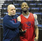  ?? DAVID JABLONSKI / STAFF 2015 ?? Kevin Kuwik (left, with ex-Flyer Scoochie Smith) did not join Indiana’s coaching staff after UD coach Archie Miller took the Hoosiers’ job in March.