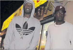  ?? MSWINCVIDE­OS/YOUTUBE ?? A video still for Jermaine Dunkley’s song “Trap” features Dunkley, left, with Reshane Hayles-Wilson, who was convicted of second-degree murder in the 2013 killing of Neeko Mitchell.