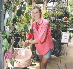  ??  ?? SAFETY FIRST: Limberlost Garden Centre horticultu­rist Elle Ryan cleans up at a hand washing station. Picture: ANNA ROGERS