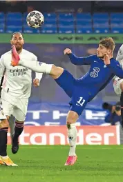  ?? — AFP ?? Chelsea’s Timo Werner (right) scores against Real Madrid in their Champions League second leg semifinal match at Stamford Bridge in London on Wednesday.