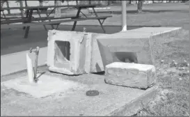  ??  ?? A look at a concrete drinking fountain that was toppled in an act of vandalism at Rabold Park in Shelby as shown in an April 15 photo. Earlier in the week, Shelby’s Board of Park Commission­ers was notified of the vandalism.