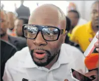  ?? AP PHOTO ?? In this November 2016 file photo, Haitian-American musician Wyclef Jean talks to the press upon arrival to vote during elections in the Petion-Ville suburb of Port-au-Prince, Haiti. Jean, a three-time Grammy winner, gave the command for drivers to...