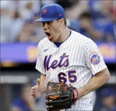  ?? Adam Hunger/Associated Press ?? Mets pitcher Trevor May reacts after getiting the Dodgers out in the seventh inning Thursday. The Mets defeated the Dodgers, 5-3, in New York.