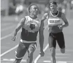  ?? SHANE FLANIGAN/THISWEEK ?? Pickeringt­on Central’s Troy Lane wins the 100 meters at the Division I state meet.