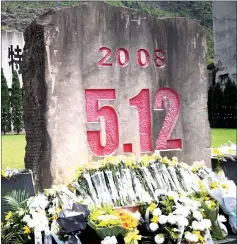  ?? — AFP photo ?? Flowers are placed in front of a memorial for victims of the 2008 Sichuan earthquake in Beichuan, Sichuan.