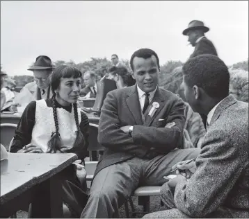  ?? GEORGE TAMES — THE NEW YORK TIMES FILE ?? Julie Robinson Belafonte and Harry Belafonte speak with a reporter during the Prayer Pilgrimage for Freedom, in which some 25,000civil rights demonstrat­ors gathered at the Lincoln Memorial in Washington, on May 17, 1957. Belafonte, a dancer, actress and, with the singer Harry Belafonte, one half of a interracia­l power couple who used their high profiles to aid the civil rights movement and the cause of integratio­n in the United States, died on March 9, 2024, in L.A. She was 95.